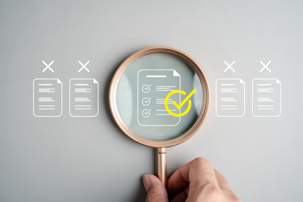 Community Health Needs Assessment Report Mistakes. Magnifying glass over check mark on a document.
